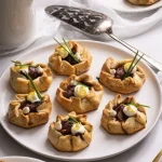 Seven Galettes with arranged on a round white serving dish.