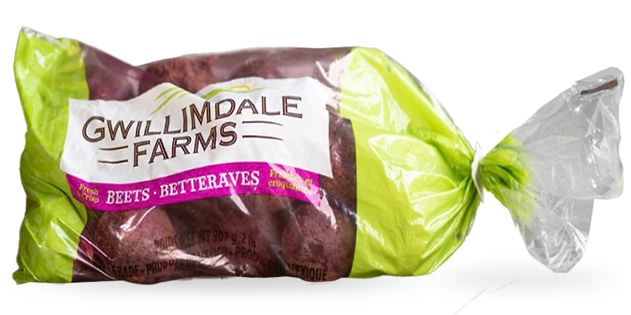 A 2lb bag of Gwillimdale farms beets. The top and bottom of the bag are solid light green, with a repeating pattern of various root vegetables, and farm imagery (barns, tractors, etc.). The middle 75% of the bag is transparent, showing the beets inside, with a large white Gwillimdale Farms logo across part of the otherwise clear portion.